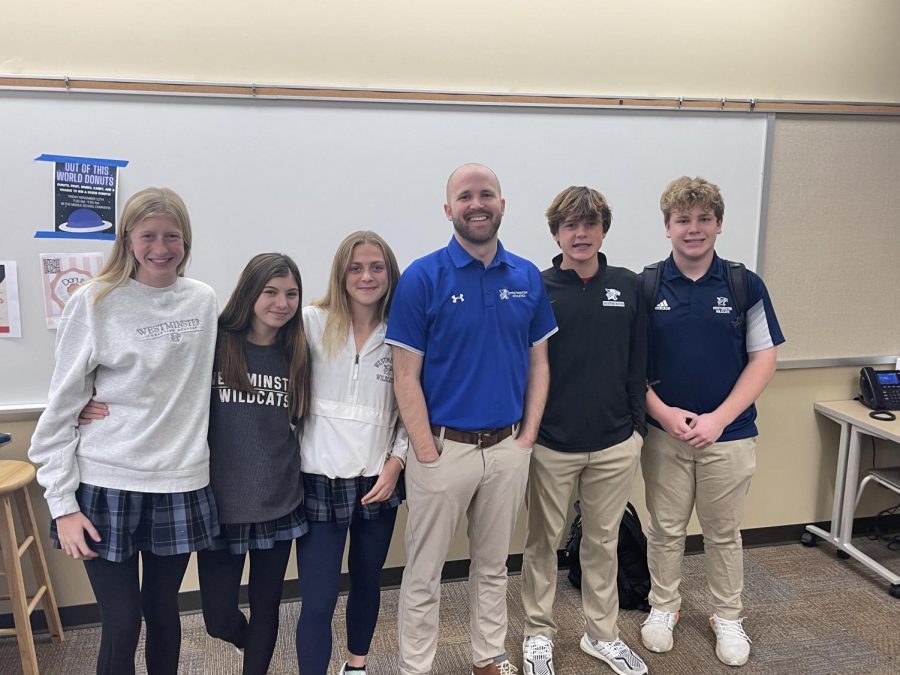 Mr. Vossen poses with some of his favorite Freshmen students.
