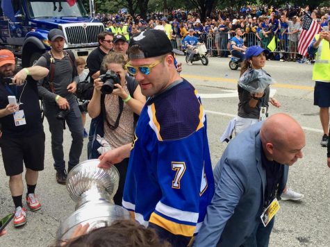Fans reach to touch the historic Stanley Cup. 