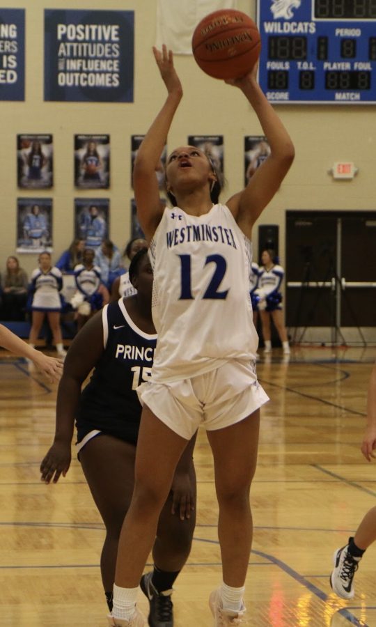 Julia Coleman, junior, goes up for a layup.