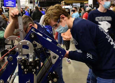 David Boylan, junior, works on electronics at the competition.
