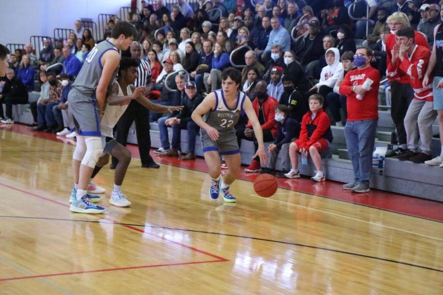 Casen Lawrence comes off a ball screen set by Austin Vick.
