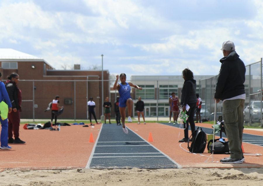 Brooke Moore, senior, attempts the triple jump and crushes the Westminster record.