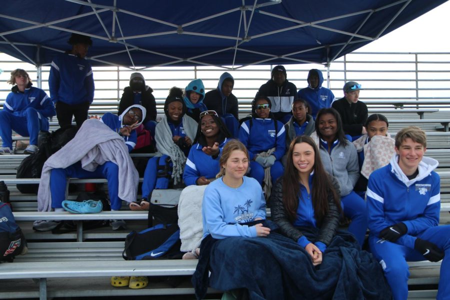 The track and field team awaits the start of their meet.