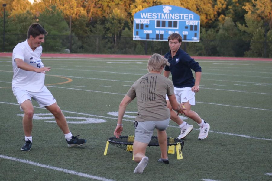 Tyler Smith and others play spike ball at FCA kickoff