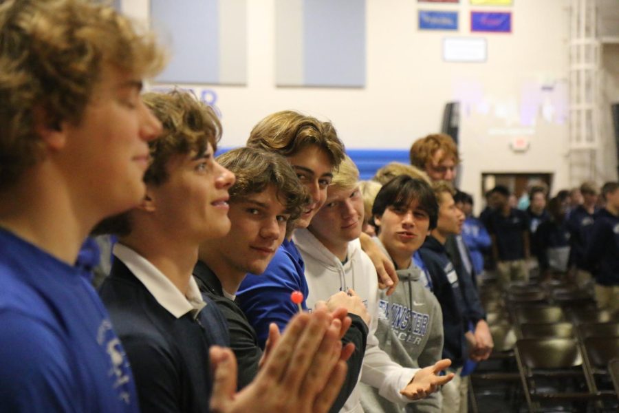 A group of high school boys get hyped up for chapel band.