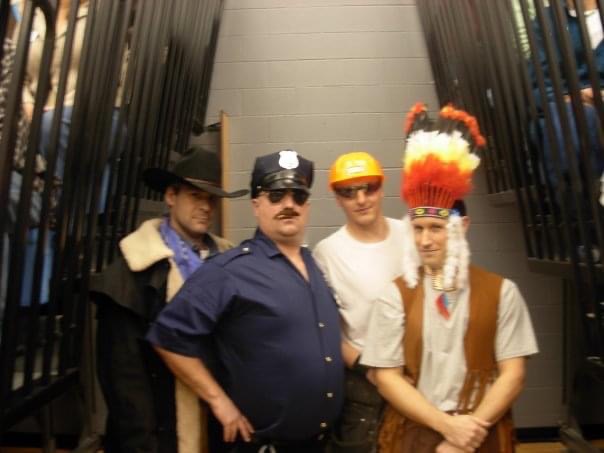 (L-R) Scott VonderBruegge, Warren Smith, Dan Legters, and Chris Knerr pose in their spirit week costume at the old campus.