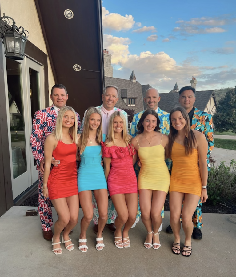 (L-R) Lauren Sowers, Libby Wessels, Kate Wessels, Sara Schloss, and Jamie Obertop pose for a picture with their dads in matching outfits outside the venue.