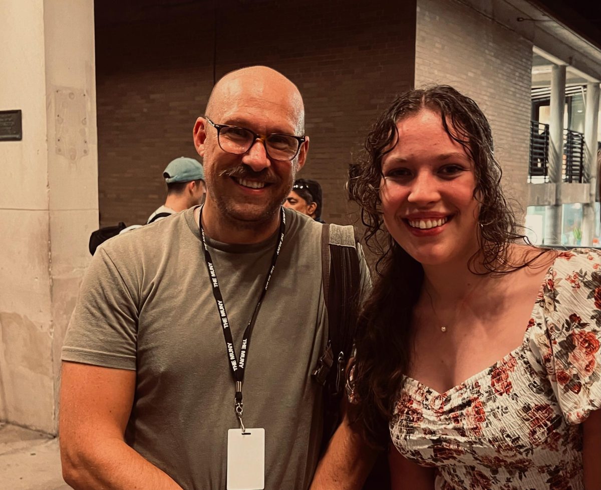 Mr. Butz and Carissa pose for a photo at the Muny.