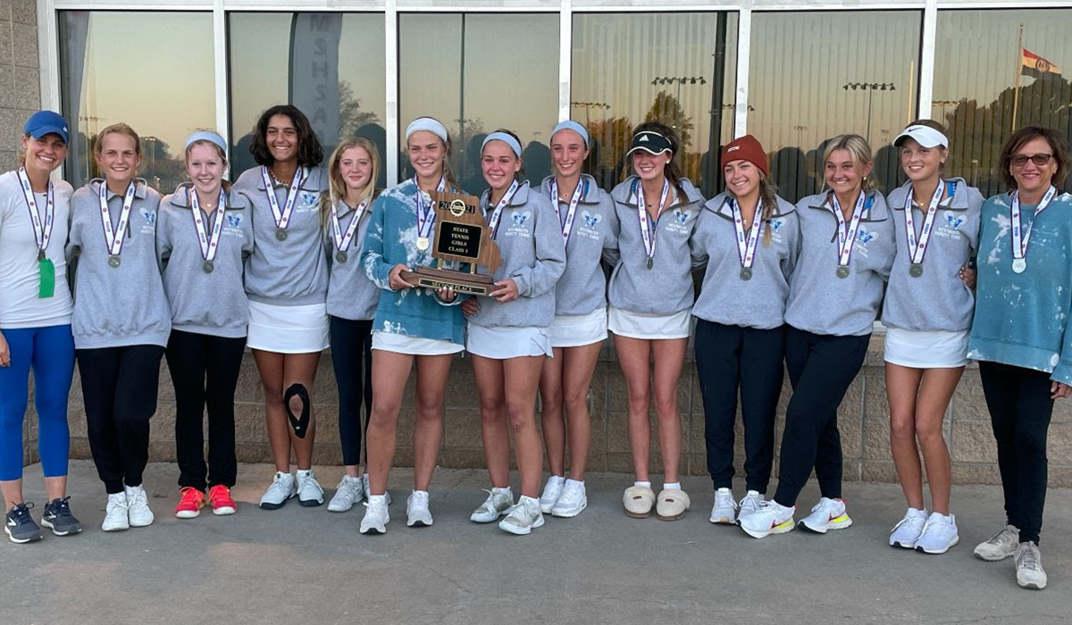 tennis team holding their trophy