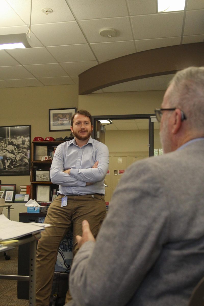 Laschinski talking with his mentor Dr. Gall about class work.