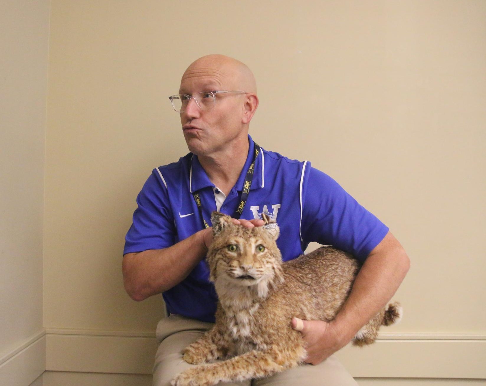 Mr. Knerr poses and holds his wildcat.