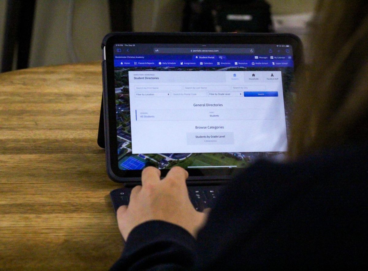 A student takes advantage of Veracross's directory system to access fellow students' personal information.