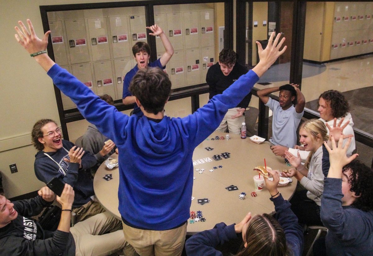 Shepherd+Perkins+wins+the+poker+game+by+a+landslide+and+stands+victoriously+
