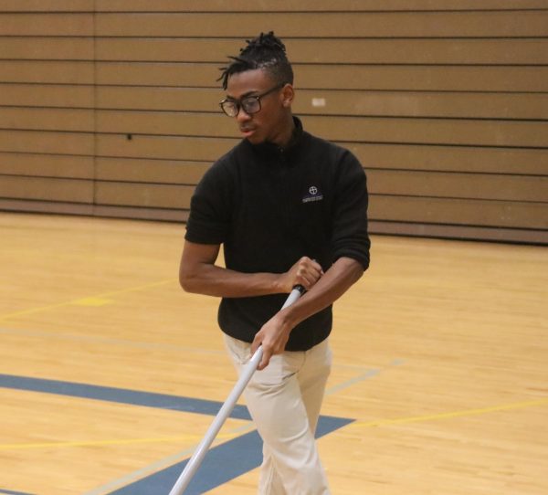 Jacobi Robinson, Senior, mopping the gymnasium.