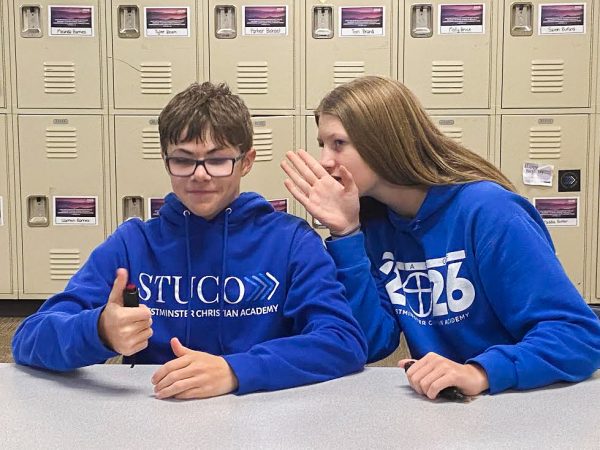 Two Scholar Bowl Members Discussing the Answer to a Question