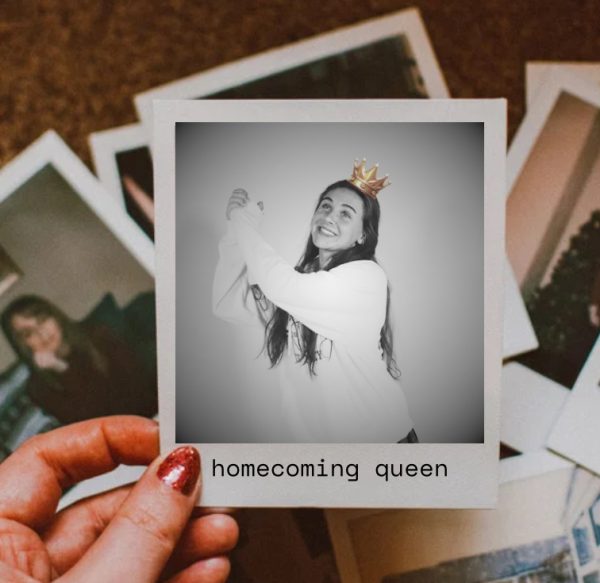 A women looks at black and white polaroid image of a past homecoming queen.  