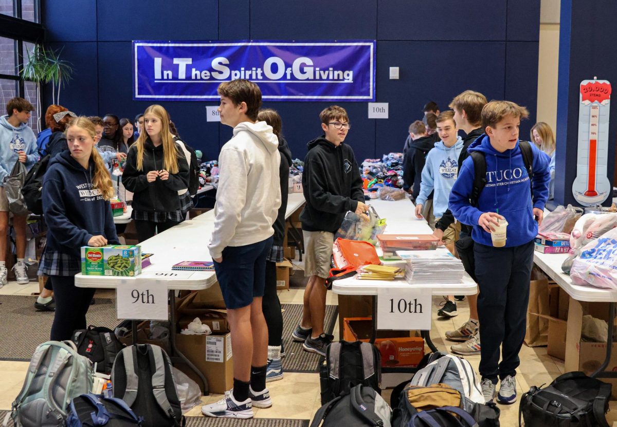 Students unload and organize ITSOG donations in the Grand Entry.