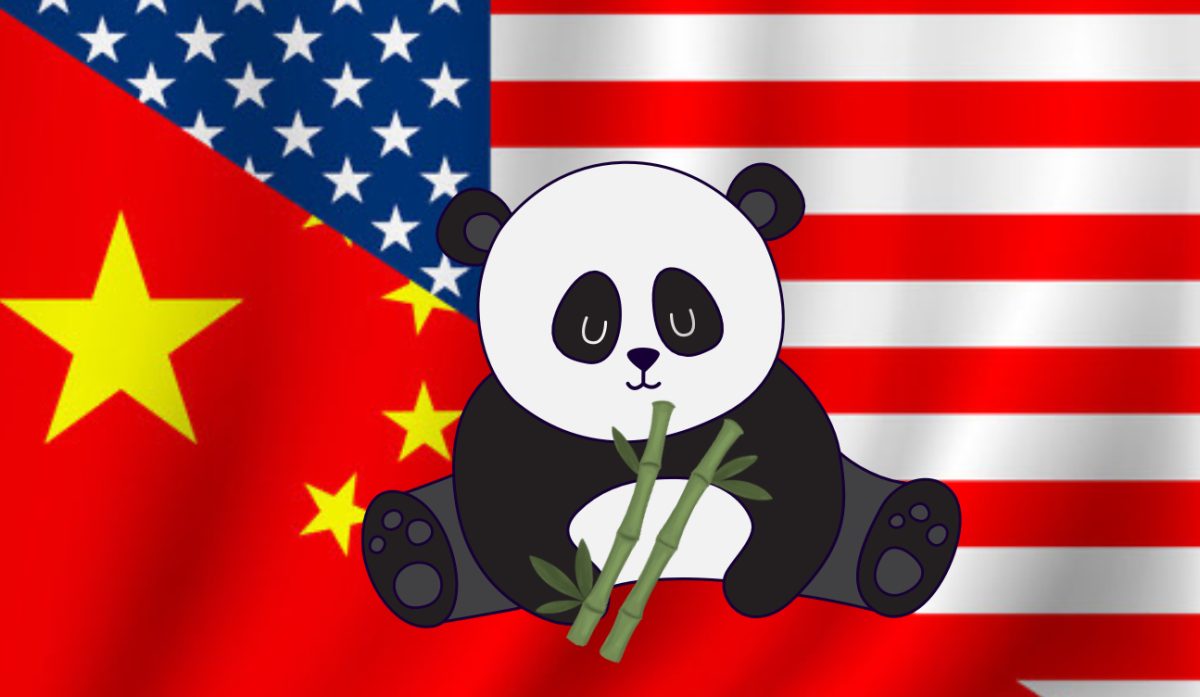 A+panda+eating+bamboo+sits+in+between+an+image+of+the+American+flag+and+the+Chinese+flag.+