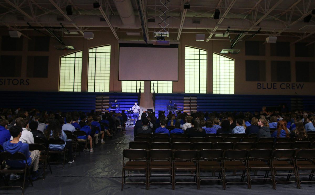 Students listen to David Ottolini during the beginning of chapel.