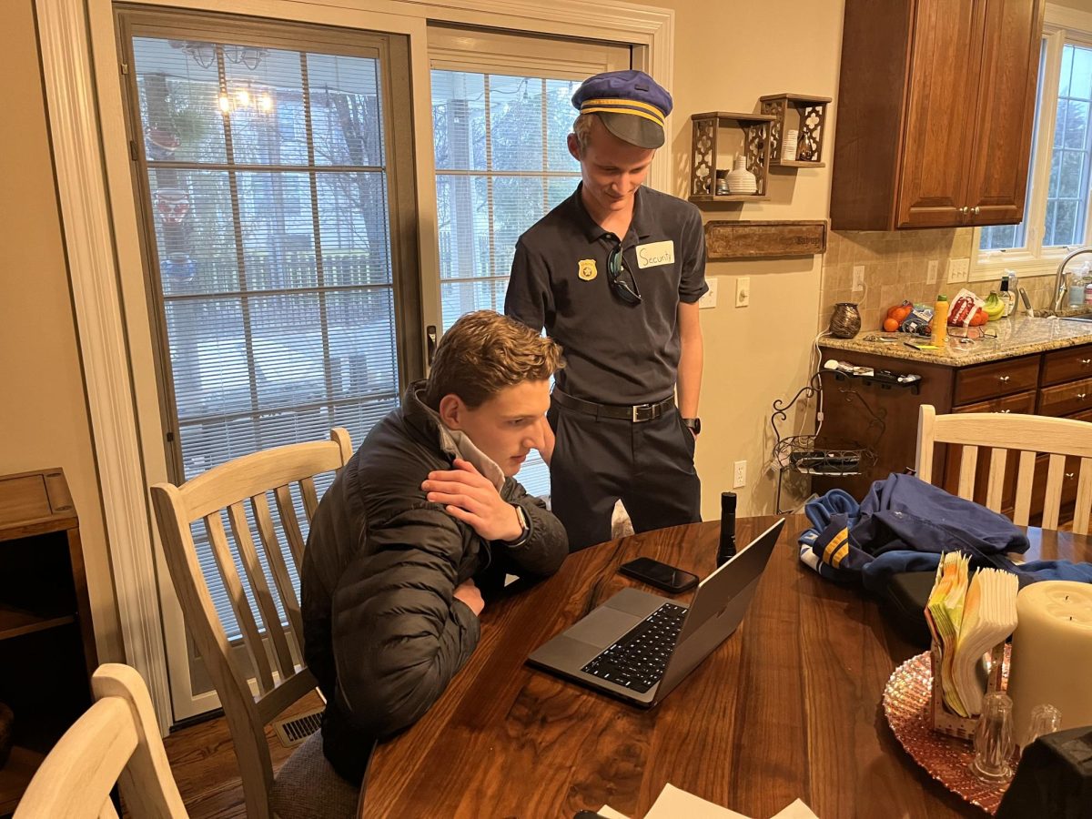 Juniors Chase Borage (left) and Casey Heironimus (right) watching this year's film project video