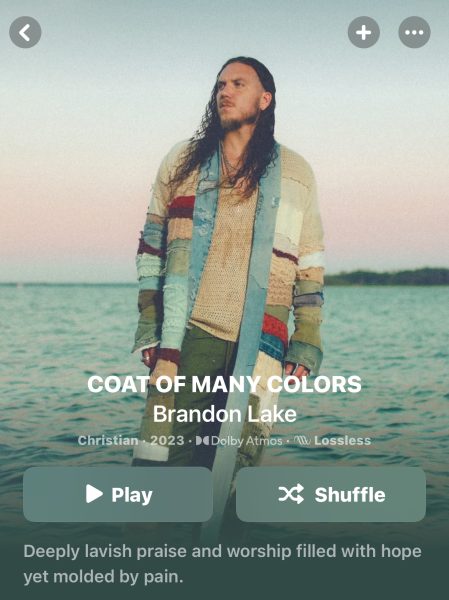 Image of Brandon Lake’s album coat of many colors picturing him standing in a colorful jacket