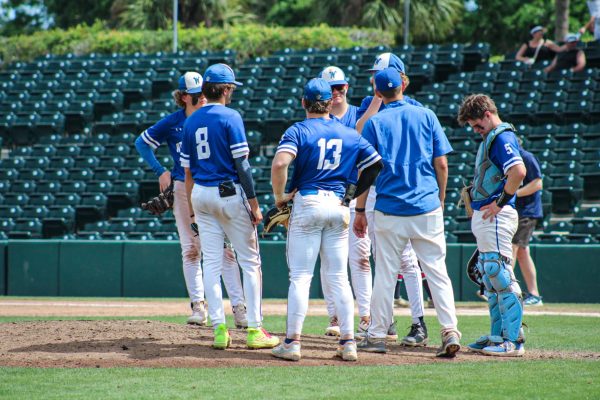 Infield huddles mid innings while in Florida at Vero Beach