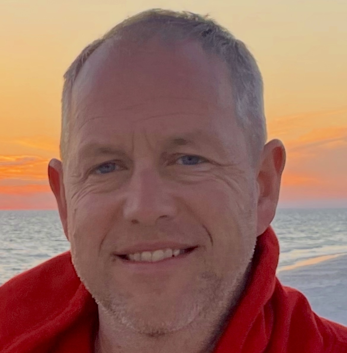 Mr. Collison Stands in Front of a Beautiful Sunset, Symbolizing the End of His Time at Westminster