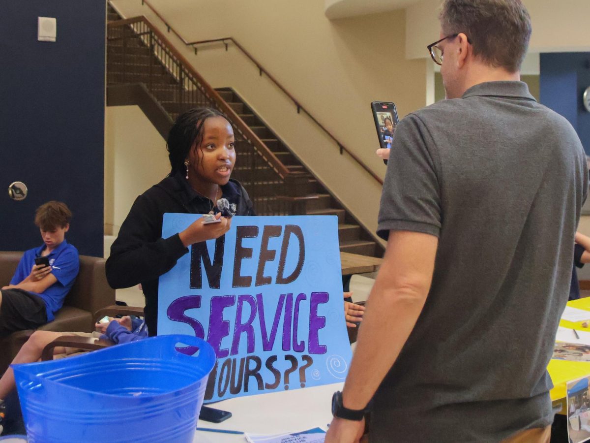 Service club representative explains the purpose and benefits of joining the club.