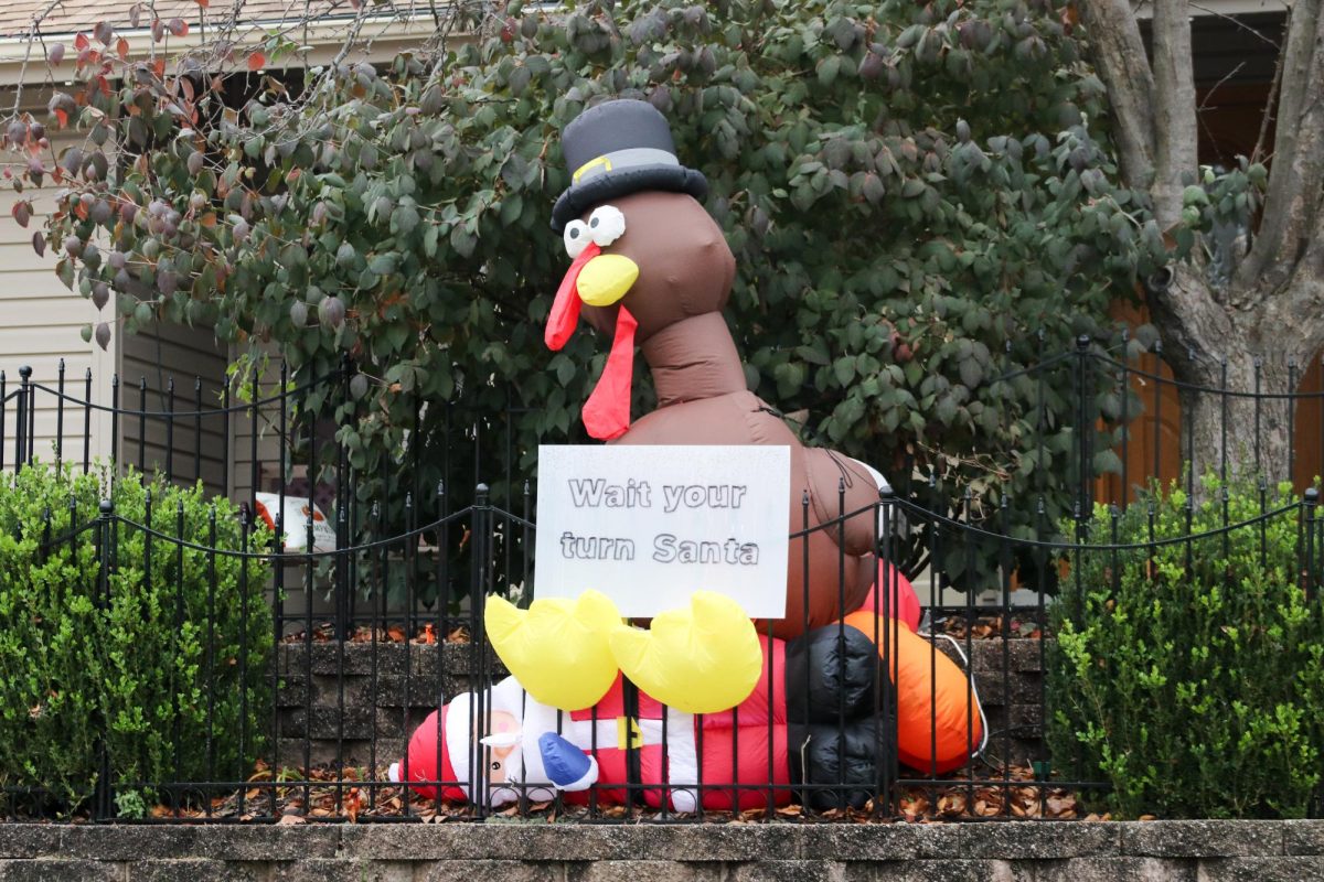 A neighborhood yard decoration encapsulates the war between Thanksgiving and Christmas