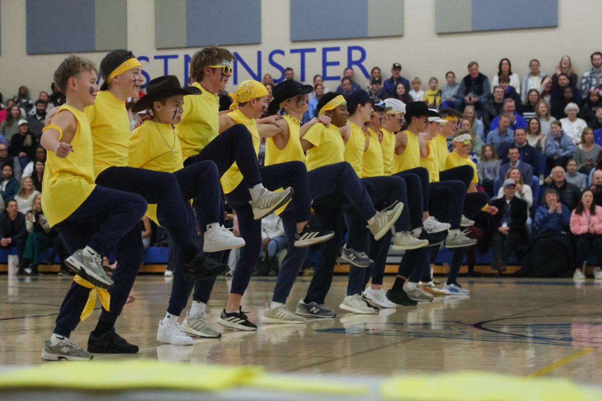 Eighth grade boys poms performs their dance for the theme Savannah Bananas