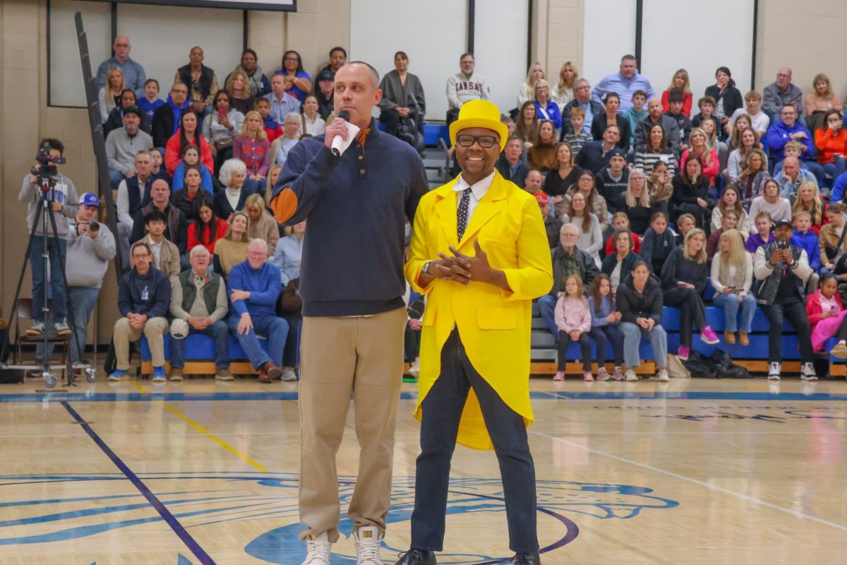 Aaron Layton and Jeff Eastham Stand in the Middle of the Arena, Announcing the Next Performance
