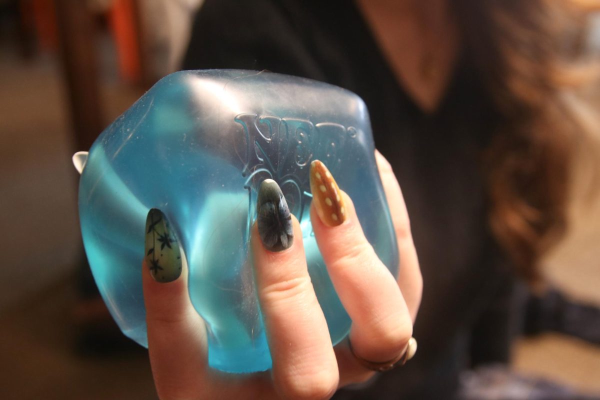 Teenager Holding a NeeDoh, a Fidget Toy that Went Viral on Social Media